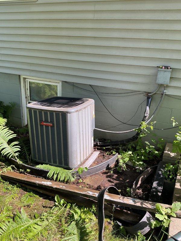 Responded to no cooling complaint with reports of unusual noise and exterior condensation on outdoor unit. Upon inspection, identified multiple issues including dirty air filter, unsecured thermostatic expansion valve (TXV) sensing bulb, low refrigerant charge, and dirty evaporator coil. Replaced air filter and properly secured TXV bulb to restore proper metering function. Due to low refrigerant levels and compromised system efficiency, provided estimate for refrigerant recharge and connected customer with project manager to discuss replacement options for aging system showing signs of deterioration including rusted outdoor pad and overgrown vegetation around condenser unit.