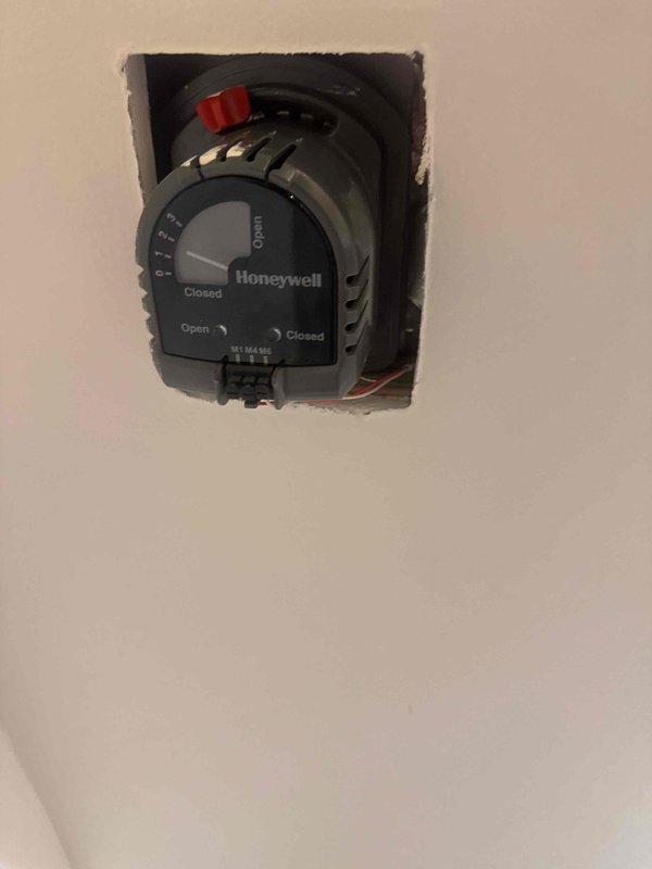 Responded to service call for a three-zone HVAC system with one zone failing to cool properly. Diagnosed a malfunctioning zone actuator that was sticking and preventing the damper from opening. Replaced the defective Honeywell zone actuator with new unit, verified proper damper operation through full open and closed cycles, and tested system to confirm restored functionality to the affected zone.