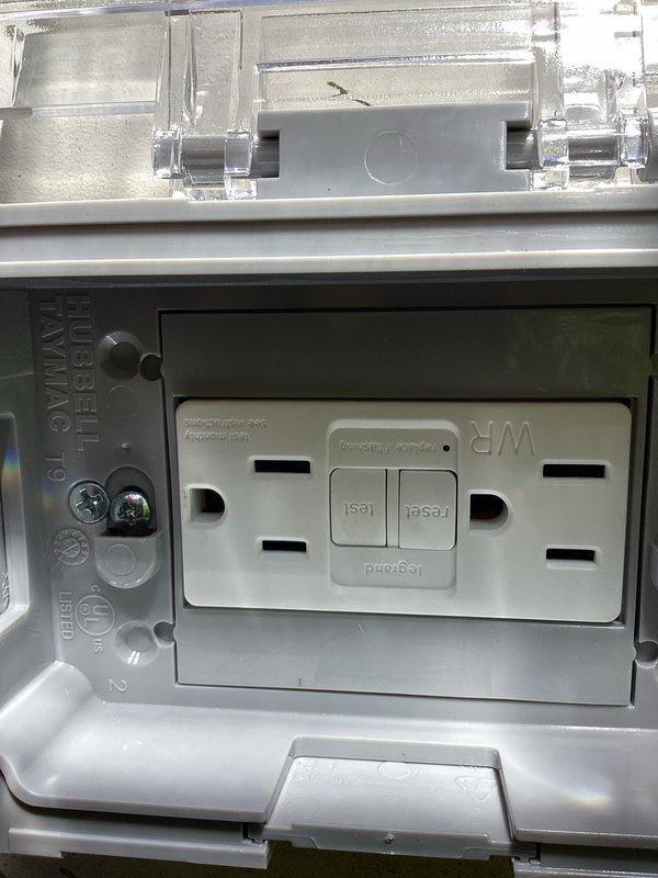 Responded to service call for exterior GFCI outlet repair. Upon arrival, diagnosed faulty exterior weatherproof GFCI receptacle that was no longer functioning properly. Removed defective outlet and weatherproof cover from exterior wall-mounted electrical box. Installed new GFCI receptacle with test and reset functionality to ensure proper ground fault protection. Mounted new weatherproof cover plate to protect outlet from environmental elements. Additionally installed knockout plug in main service panel to seal unused opening and maintain panel integrity. Tested new GFCI outlet for proper operation and verified reset function working correctly. All work completed to code specifications.