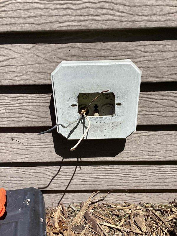 Responded to service call for exterior GFCI outlet repair. Upon arrival, diagnosed faulty exterior weatherproof GFCI receptacle that was no longer functioning properly. Removed defective outlet and weatherproof cover from exterior wall-mounted electrical box. Installed new GFCI receptacle with test and reset functionality to ensure proper ground fault protection. Mounted new weatherproof cover plate to protect outlet from environmental elements. Additionally installed knockout plug in main service panel to seal unused opening and maintain panel integrity. Tested new GFCI outlet for proper operation and verified reset function working correctly. All work completed to code specifications.