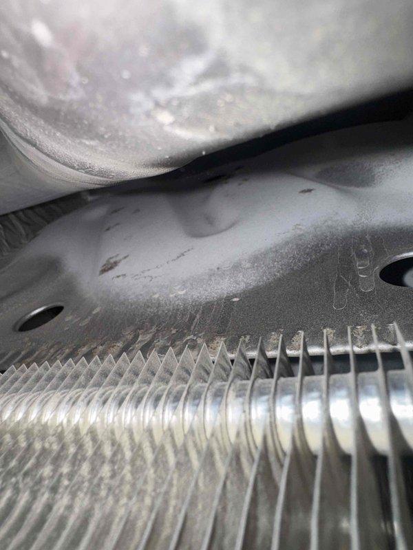 Responded to service call for second opinion on furnace diagnosis. Upon arrival, performed thorough inspection of heating system and confirmed presence of cracked heat exchanger, which poses potential safety hazard due to possible carbon monoxide leakage. Additionally identified clogged evaporator coil restricting airflow and reducing system efficiency. Documented findings with photographic evidence showing internal mechanical components, piping assembly, electrical connections, heat exchanger fins, and coil condition. Reviewed safety concerns with occupant regarding cracked heat exchanger and recommended immediate system replacement. Scheduled follow-up appointment with project manager to provide complete system replacement estimate and discuss available equipment options.