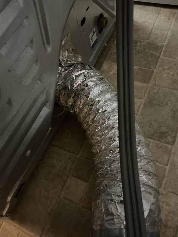Responded to service call for dryer vent disconnection issue. Upon arrival, found flexible aluminum ductwork repeatedly detaching from dryer unit due to improper securing method with incorrect tape application. Properly secured dryer vent connection using appropriate materials and techniques to ensure reliable attachment at appliance junction point, resolving the disconnection problem.