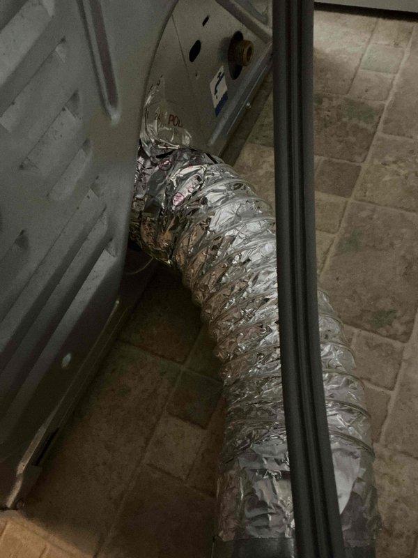 Responded to service call for dryer vent disconnection issue. Upon arrival, found flexible aluminum ductwork repeatedly detaching from dryer unit due to improper securing method with incorrect tape application. Properly secured dryer vent connection using appropriate materials and techniques to ensure reliable attachment at appliance junction point, resolving the disconnection problem.
