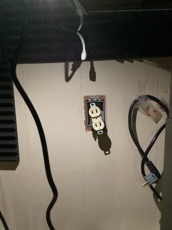 Responded to service call for non-functional electrical outlet being used with portable air conditioning unit. Upon inspection, determined that the existing outlet circuit was insufficient to handle the electrical load requirements of the AC unit. Installed new dedicated circuit with appropriate amperage capacity and replaced the outlet to safely accommodate the portable air conditioner, ensuring compliance with electrical code requirements for high-draw appliances.
