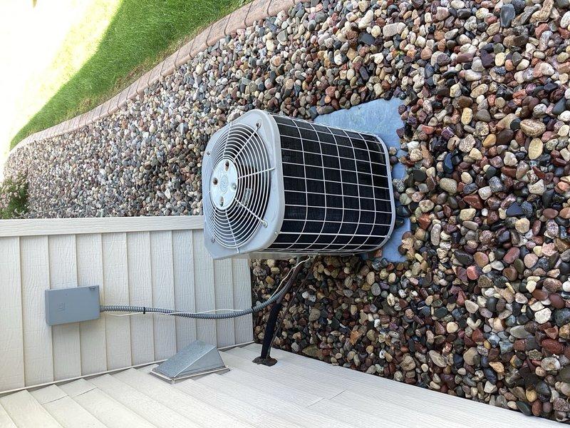 Completed comprehensive air conditioning tune-up on outdoor condenser unit. Performed standard maintenance procedures including inspection of cylindrical fan assembly, condenser coils, electrical connections, and refrigerant levels. Unit found to be operating within normal parameters with no deficiencies identified or repairs required.