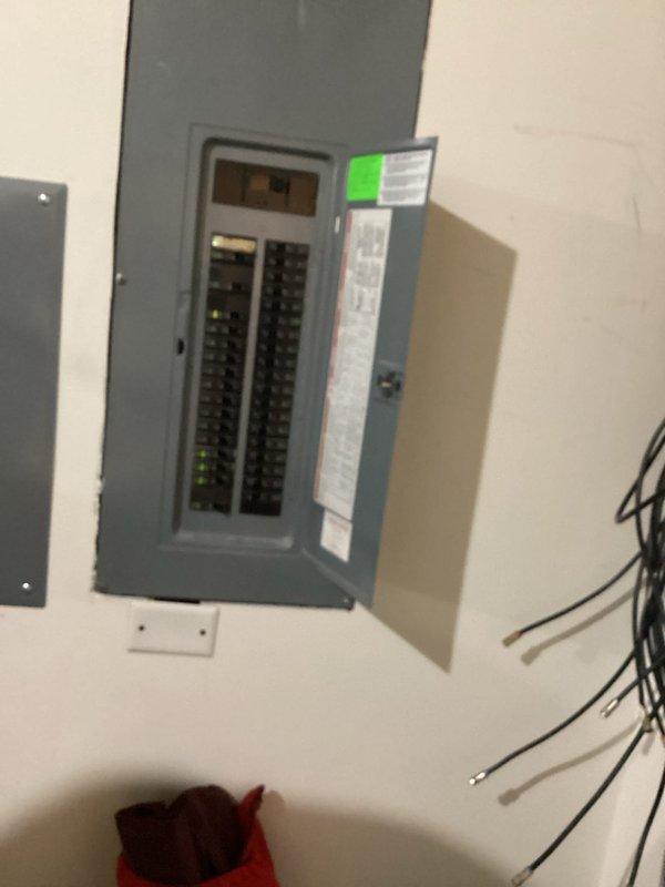 Conducted on-site evaluation for customer-supplied EV charger installation. Assessed existing electrical panel located on shared wall between residence and garage. Documented panel configuration and available breaker capacity. Provided detailed installation estimate which was reviewed and approved by customer.