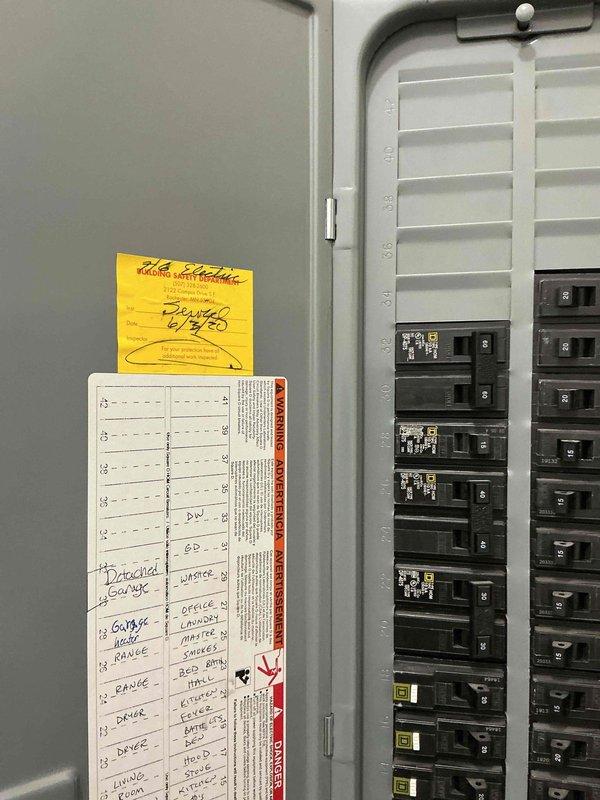 Completed full electrical rough-in and trim work for detached garage structure. Installed complete wiring system, circuit breaker panel with properly labeled circuit directory, and exterior gooseneck lighting fixture above entry door. Work was coordinated with scheduled rough-in inspection and all installations completed to code specifications.