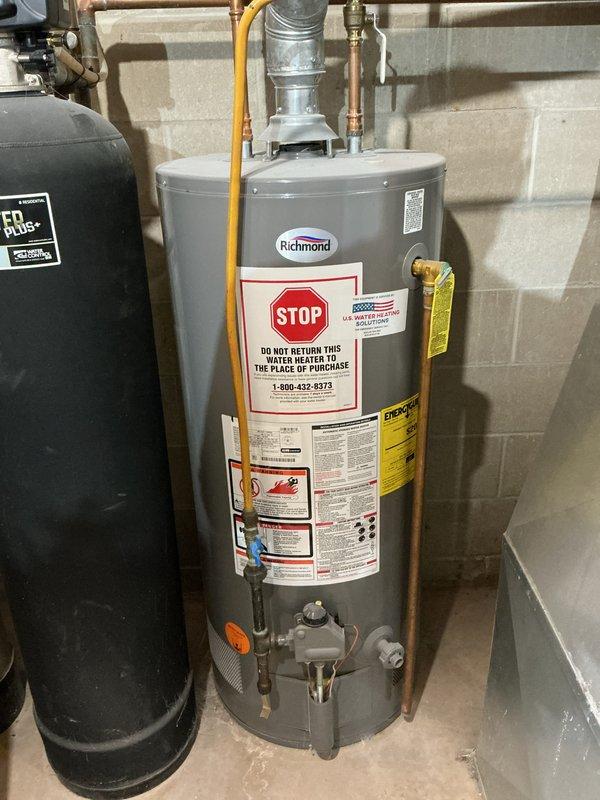 Conducted on-site evaluation for water heater replacement in basement utility area. Assessed existing 40-gallon atmospheric vent Richmond water heater and provided estimate for upgrading to 40-gallon power vent model. Documented current installation including atmospheric venting configuration, copper water piping connections, flexible gas line routing, and gas control valve assembly. Evaluated necessary modifications for power vent conversion, including electrical requirements, revised venting pathway, and compatibility with existing plumbing connections. Photographed equipment and surrounding area to support estimate preparation.