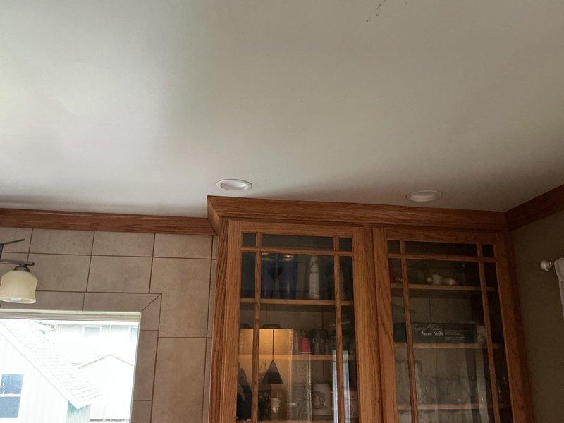 Completed installation of recessed can lights in residential living room and kitchen areas. Removed existing fixtures and replaced with new recessed lighting units in ceiling locations. Work included proper electrical connections, securing fixtures to ceiling joists, and testing all new lights for proper operation. All replaced can lights are functioning correctly and provide improved illumination throughout both spaces.