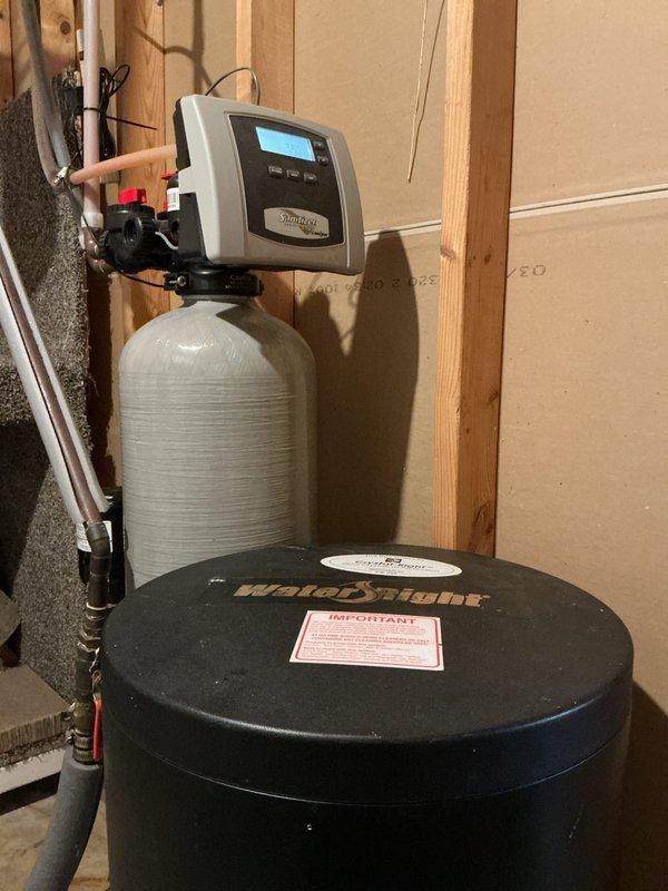 Performed scheduled maintenance on WaterRight water softener system, including comprehensive inspection, tank purge, and cleaning with professional water softener cleaner. Replaced sediment filter with customer-supplied unit and verified all copper plumbing connections, control valves, and digital control head were functioning properly. System tested and found operating within normal parameters with no deficiencies identified.