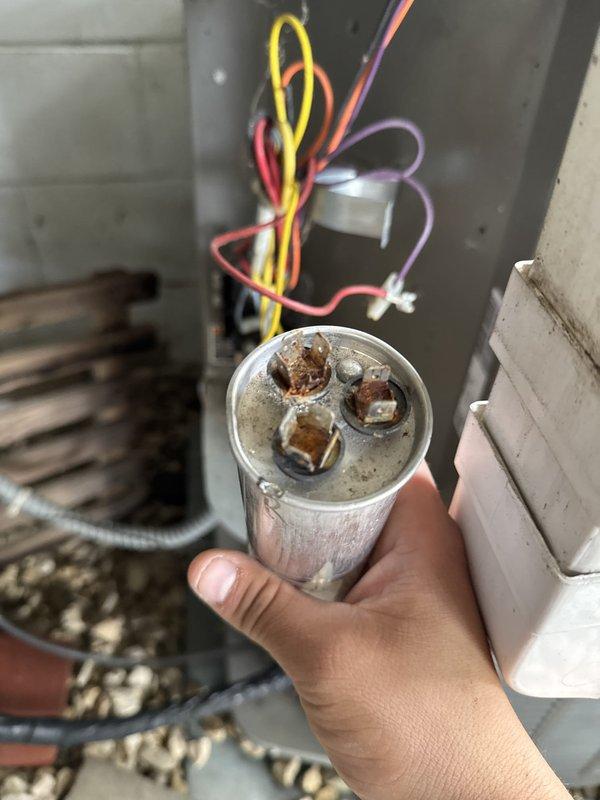Performed comprehensive AC and furnace maintenance tune-up on residential HVAC system. Upon inspection, discovered heavily soiled air filter restricting airflow and a weak capacitor showing visible corrosion on terminals. Replaced the contaminated filter with new unit to restore proper airflow and system efficiency. Removed and replaced the failing capacitor to prevent potential system failure and ensure reliable operation. System tested and confirmed operational following component replacements.
