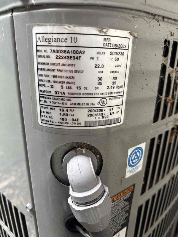 Performed comprehensive AC and furnace maintenance on a 2002 American Standard Allegiance 10 system. Identified critical furnace venting issue with extensive water damage present in the unit and visible corrosion on mounting components. Discovered outdoor condensing unit was significantly low on R-22 refrigerant, requiring attention. Documented equipment conditions with photos showing manufacturer specifications, water damage evidence, and rust deterioration on internal brackets. Recommended preventative maintenance plan to address identified deficiencies.