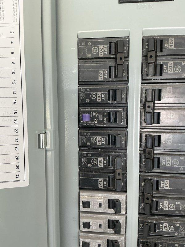 Installed GFCI outlet in garage to provide ground fault protection per electrical code requirements. Replaced standard washer circuit breaker with GFCI breaker in main electrical panel to ensure proper ground fault protection for laundry appliance circuit.