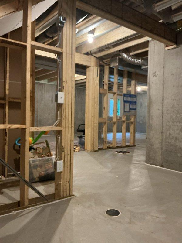Performed site assessment for gas-to-electric dryer conversion in unfinished basement laundry area. Evaluated existing electrical panel capacity and determined routing requirements for new dedicated circuit. Proposed installation plan includes running exterior conduit from main electrical panel to laundry room location to accommodate 240V dryer circuit, with conduit penetration through exterior wall and interior routing to appliance location.
