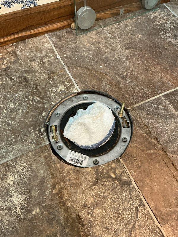 Responded to toilet leak occurring during flushing that caused water damage to ceiling below. Diagnosed failed toilet flange as source of leak and completed flange repair to restore proper seal between toilet and drain line. Recommended replacement of existing toilet due to age and inefficient water consumption of 2 gallons per flush compared to modern 1.28 gallon models for improved water efficiency.