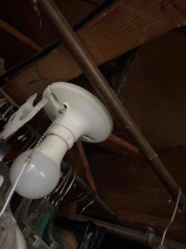 Responded to service call for non-functioning basement light fixture located directly below a recently installed upstairs bathroom light. Upon inspection, determined the existing fixture had failed. Removed defective porcelain pull-chain light fixture and installed new keyless porcelain fixture in unfinished basement area. Verified proper electrical connections and tested operation to ensure functionality was restored.