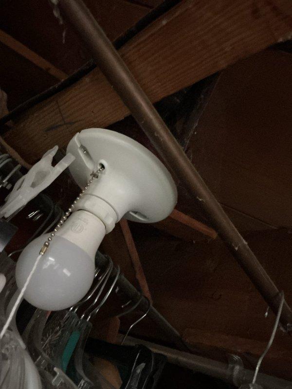 Responded to service call for non-functioning basement light fixture located directly below a recently installed upstairs bathroom light. Upon inspection, determined the existing fixture had failed. Removed defective porcelain pull-chain light fixture and installed new keyless porcelain fixture in unfinished basement area. Verified proper electrical connections and tested operation to ensure functionality was restored.