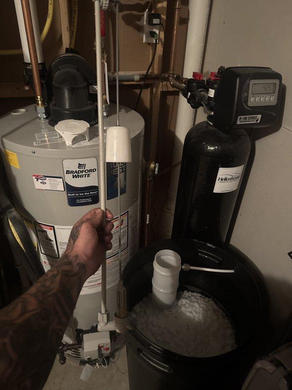 Responded to water softener malfunction with persistent high water level in brine tank. Initial troubleshooting included system flushing and salt replenishment, which did not resolve the issue. Diagnosed faulty component requiring replacement part, coordinated follow-up appointment for part installation and completed repair of water treatment system.