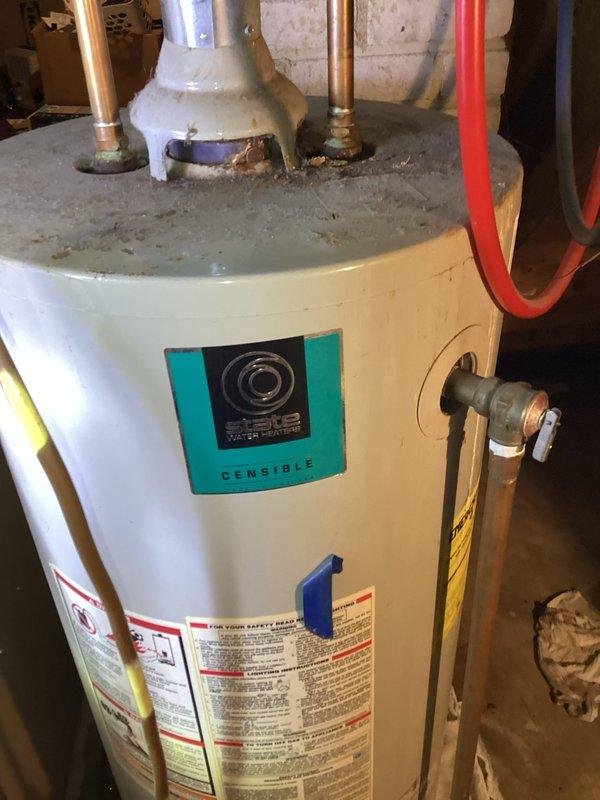 Arrived on-site and conducted a comprehensive assessment of the existing State brand 40-gallon atmospheric vent natural gas water heater located in the basement utility area. Upon inspection, noted visible corrosion and rust accumulation at the top connections and fittings, indicating age-related deterioration. Documented the current installation configuration including copper supply piping, pressure relief valve assembly, and venting system. Prepared detailed estimate for replacement with a new 40-gallon atmospheric vent natural gas water heater, including all necessary materials, connections, and code-compliant installation requirements.