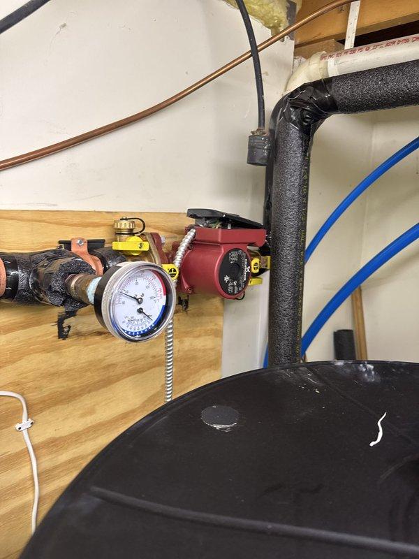 Completed geothermal warranty service callback to finalize electrical connections and system commissioning. Upon arrival, properly wired and connected the geothermal system components that were previously incomplete from initial installation. Securely mounted circulator pumps to wooden platform and insulated all pump bodies and associated piping with foam insulation per manufacturer specifications. Verified system pressure with gauge, confirmed all electrical connections, and tested circulation operation. System now fully operational and properly installed.