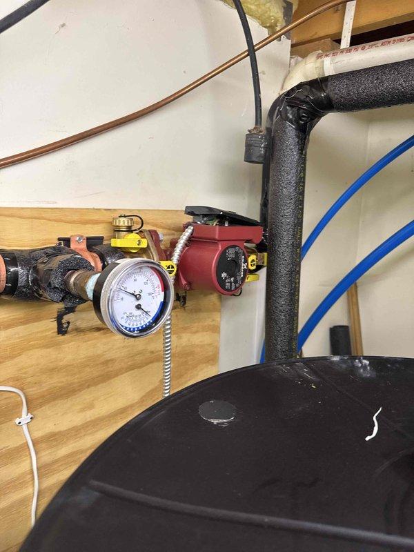 Completed geothermal warranty service callback to finalize electrical connections and system commissioning. Upon arrival, properly wired and connected the geothermal system components that were previously incomplete from initial installation. Securely mounted circulator pumps to wooden platform and insulated all pump bodies and associated piping with foam insulation per manufacturer specifications. Verified system pressure with gauge, confirmed all electrical connections, and tested circulation operation. System now fully operational and properly installed.