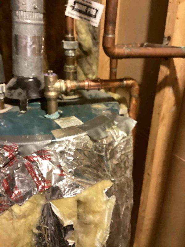 Responded to a water heater leak in the mechanical room. Upon arrival, identified the temperature and pressure relief valve as the source of continuous dripping onto the floor. Removed the faulty T&P valve and installed a new replacement unit. Tested the system to confirm proper operation with no further leaks or dripping detected. Water heater returned to normal function.