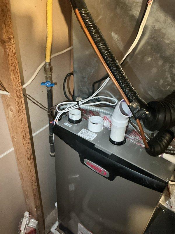 Responded to no heat call on furnace unable to maintain temperature above 70°F despite thermostat set to 75°F. Upon inspection, discovered incomplete installation with exhaust venting never connected and gas supply shut off at valve. Unit was non-operational due to these critical installation deficiencies. Documented conditions with photographs showing disconnected exhaust piping and closed gas shut-off valve. Installation crew scheduled to return to complete proper venting connection and restore gas service to bring system into full operational status.