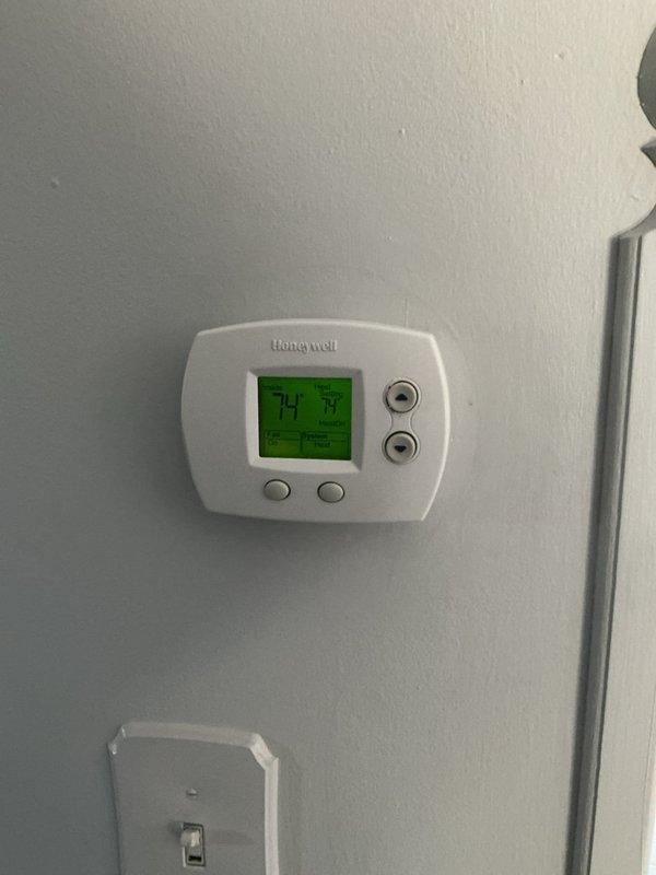 Responded to no heat call and diagnosed thermostat malfunction. Found batteries improperly seated in the unit, preventing proper operation. Corrected battery placement and replaced thermostat to restore heating system functionality.
