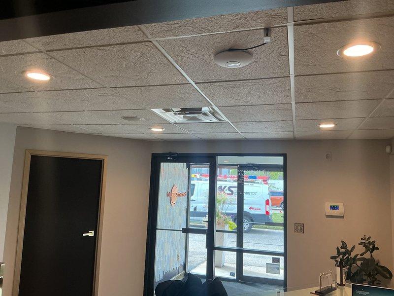 Responded to service call for flickering and non-functioning light fixtures in commercial office space. Diagnosed burnt out recessed can lights in drop ceiling system and successfully replaced four defective recessed light fixtures, restoring full illumination to the area.