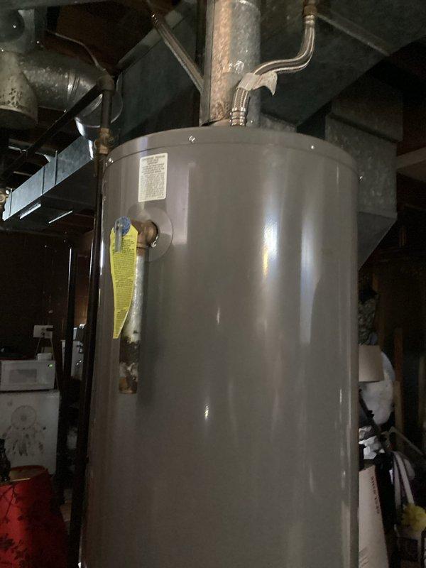 Responded to service call for water heater not staying lit. Upon arrival, performed diagnostic inspection and identified obstruction of combustible air intakes caused by storage items placed in close proximity to the unit. Cleared adequate clearance around the water heater to ensure proper ventilation and combustion air supply. Successfully relit pilot light and verified burner ignition and operation. Tested unit through complete heating cycle with all systems functioning properly. Educated property occupant on required clearances around gas-fired appliances for safe operation and code compliance.