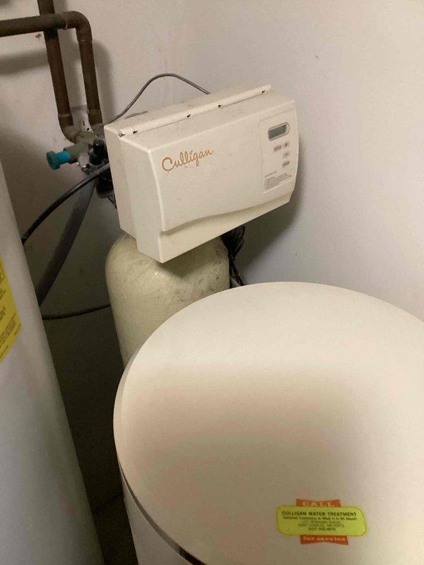 Conducted on-site evaluation of residential water treatment needs in utility room. Assessed existing plumbing infrastructure including copper piping configuration and available space for installation. Provided comprehensive estimate for Culligan water softener system installation, reviewing equipment specifications, required connections to main water supply line, and optimal placement for the softener unit and brine tank.