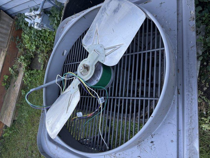 Responded to service call for outdoor condensing unit with failed fan motor. Replaced defective motor with new unit, completed electrical connections, and verified proper operation. System restored to normal cooling function.