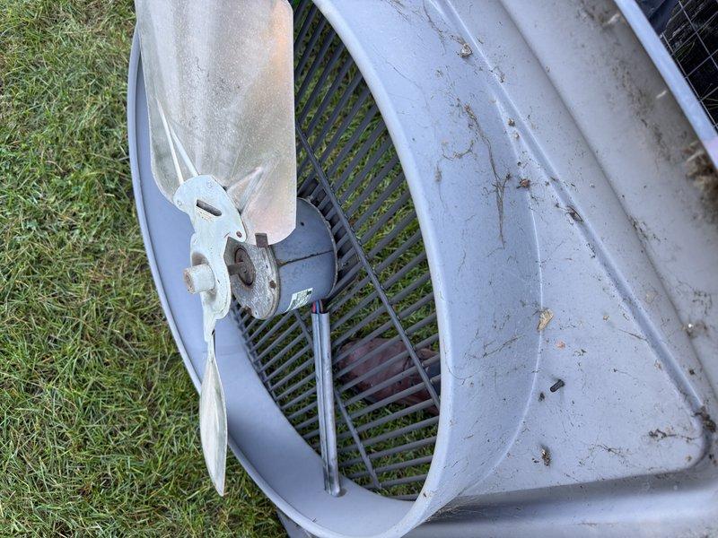 Responded to service call for outdoor condensing unit with failed fan motor. Replaced defective motor with new unit, completed electrical connections, and verified proper operation. System restored to normal cooling function.