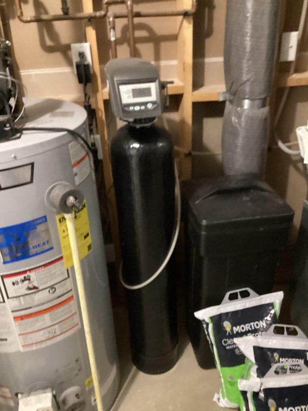 Responded to service call for domestic well water with reported odor and cloudiness. Upon inspection, tested water quality and confirmed elevated iron levels causing the discoloration and smell. Documented existing water treatment system including water softener and heater configuration. Provided estimate for iron filter installation to resolve water quality issues.