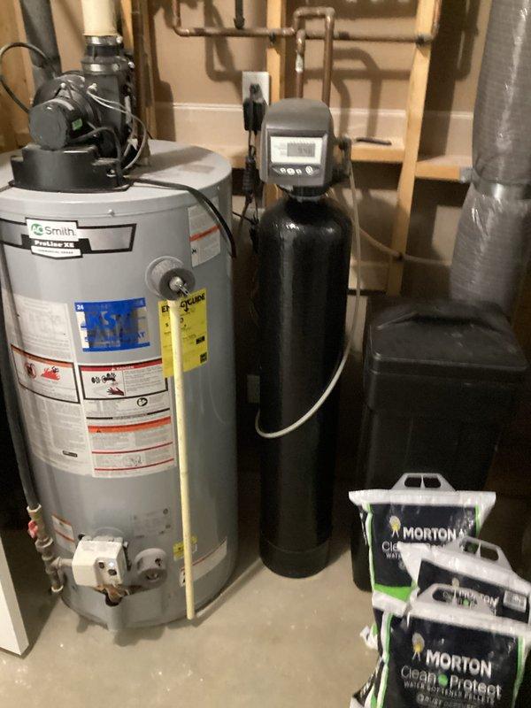 Responded to service call for domestic well water with reported odor and cloudiness. Upon inspection, tested water quality and confirmed elevated iron levels causing the discoloration and smell. Documented existing water treatment system including water softener and heater configuration. Provided estimate for iron filter installation to resolve water quality issues.