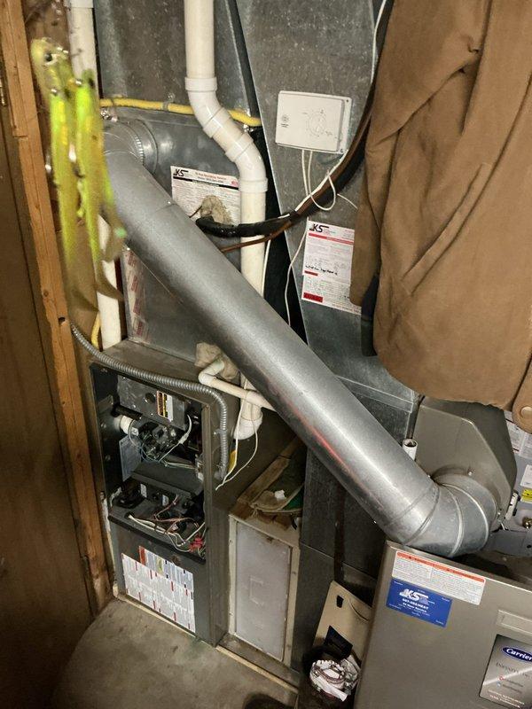 Responded to no heat call and found furnace operating but delivering cold air with thermostat communication issues. Diagnosed failed ECM inducer motor preventing proper ignition sequence. Due to the age and overall condition of the unit, recommended complete system replacement as the most cost-effective solution rather than proceeding with motor replacement repair.