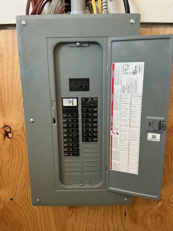 Completed electrical service changeout including installation of new exterior meter socket and new interior electrical panel in garage. Coordinated with utility company for disconnect and reconnection, obtained state electrical permit, and scheduled required onsite inspection. All circuit breakers properly installed and labeled, with panel mounted securely to structural wall and all connections made to code specifications.