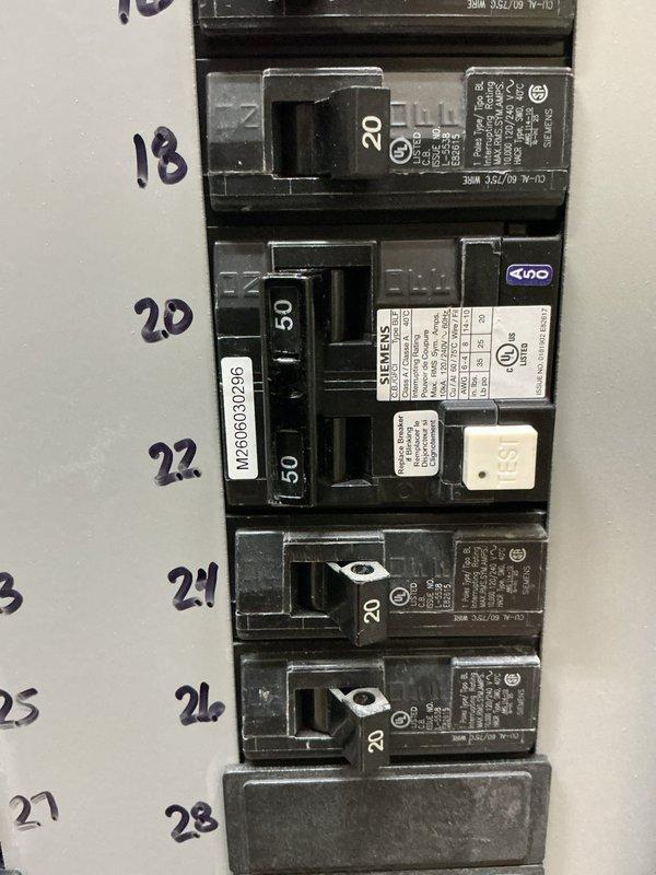 Completed electrical panel work by installing the final GFCI circuit breaker in the panel and finishing the wiring connections. Tested the range circuit to verify proper operation and confirmed all breaker installations met code requirements. The GFCI breaker was properly labeled and is now protecting the designated circuit as intended.
