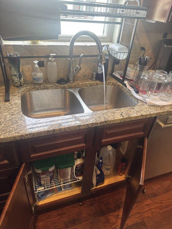 Responded to service call for kitchen drainage issues and odor complaints. Upon arrival, inspected dual-basin kitchen sink system, garbage disposal unit, and associated drain lines between sink and dishwasher connection. Conducted thorough assessment of plumbing fixtures and drainage performance in both kitchen and bathroom areas. After complete inspection and testing of all reported concerns, determined that no plumbing issues were present. All drain lines flowing properly, garbage disposal operating within normal parameters, and no source of odor detected at time of service. System functioning as designed with no repairs or interventions required.