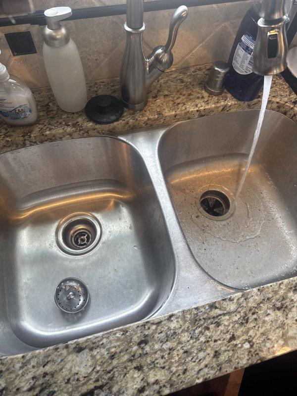 Responded to service call for kitchen drainage issues and odor complaints. Upon arrival, inspected dual-basin kitchen sink system, garbage disposal unit, and associated drain lines between sink and dishwasher connection. Conducted thorough assessment of plumbing fixtures and drainage performance in both kitchen and bathroom areas. After complete inspection and testing of all reported concerns, determined that no plumbing issues were present. All drain lines flowing properly, garbage disposal operating within normal parameters, and no source of odor detected at time of service. System functioning as designed with no repairs or interventions required.