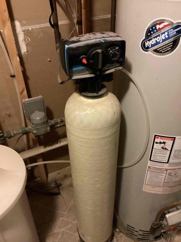Responded to service call for non-functioning water softener. Upon inspection, diagnosed that the water softener was not regenerating properly and tested water hardness at 22 ppm, indicating the unit had failed to condition the water supply. Provided estimate for replacement water softener installation, as existing unit was beyond repair.