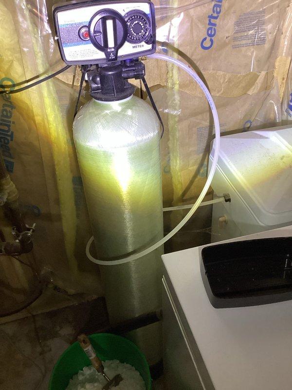 Responded to service call for non-functioning water softener system. Upon inspection, discovered the unit had been inadvertently placed in bypass mode, preventing soft water from circulating through the home. Repositioned the bypass valve to restore the softener to active service mode, immediately resolving the issue and returning the system to normal operation.