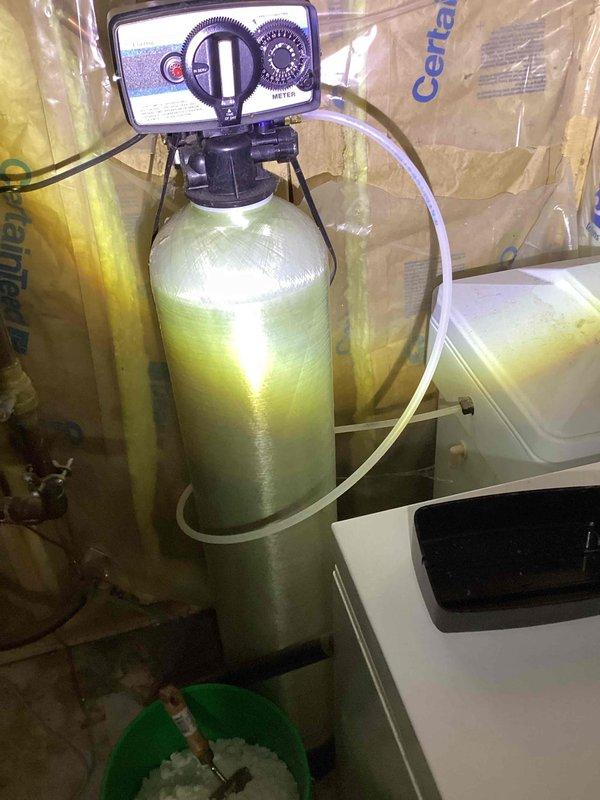 Responded to service call for non-functioning water softener system. Upon inspection, discovered the unit had been inadvertently placed in bypass mode, preventing soft water from circulating through the home. Repositioned the bypass valve to restore the softener to active service mode, immediately resolving the issue and returning the system to normal operation.