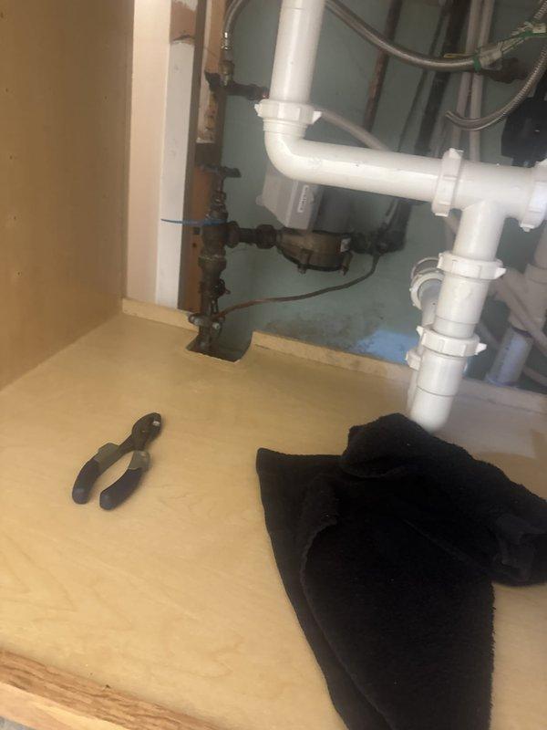 Responded to a water leak at the main shut off valve. Upon inspection, identified the leak was caused by loose packing around the valve stem rather than a faulty O-ring. Tightened the packing nut to compress the packing material and create a proper seal, which successfully stopped the leak. No parts replacement was necessary.