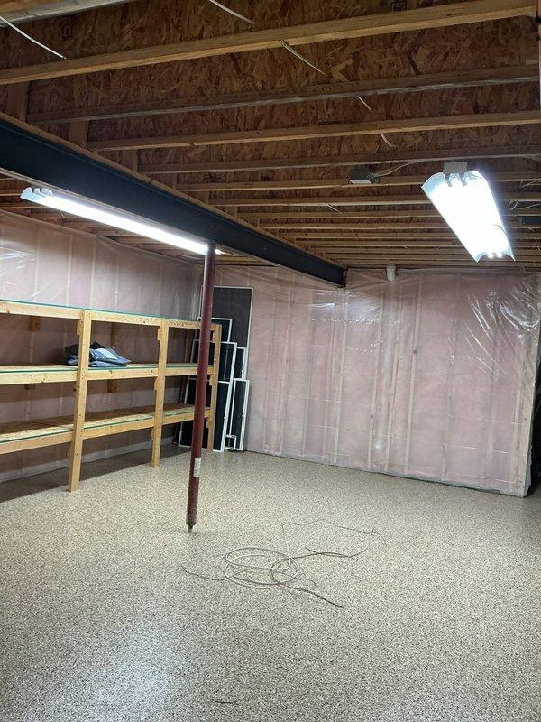 Completed basement lighting upgrades including retrofitting three 8-foot fluorescent strip lights to LED technology. Replaced outdated under-cabinet fluorescent fixtures in laundry area with new LED fixtures, removed upper cabinet lights, and properly secured all associated wiring. Installed new smoke detector to bring system up to current safety standards.