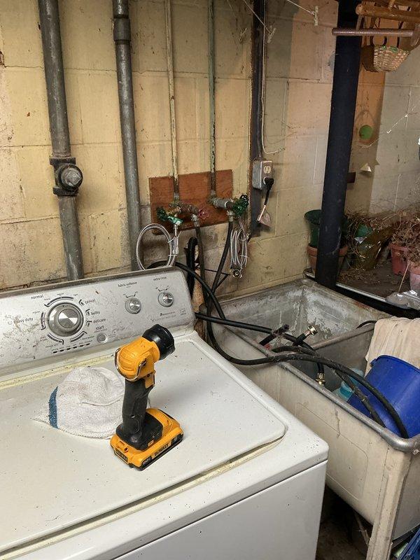 Responded to service call for slow-draining tub and corroded washing machine water supply valves. Upon inspection, found two shut-off valves connecting to the washing machine supply lines were severely corroded and required replacement. Successfully removed old corroded valves and installed new shut-off valves with wheel handles for both hot and cold water supply lines. Connected flexible braided stainless steel supply lines to the new valves and verified proper water flow and shutoff functionality. Tested washing machine connections for leaks and confirmed all plumbing connections were secure and operational.