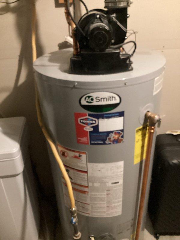 Arrived on-site and assessed existing A.O. Smith 50-gallon natural gas power vent water heater installation. Documented current equipment specifications, connections, and utility room configuration including copper supply piping, brass fittings, yellow-tagged valve assembly, and power vent motor mounted on top of unit. Prepared comprehensive estimate for replacement of 50-gallon natural gas power vent water heater with comparable equipment and necessary connections.