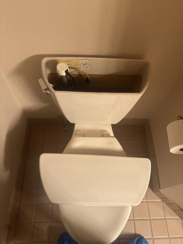 Responded to service call for toilet continuously running and tank constantly filling. Upon inspection, diagnosed failed fill valve assembly as the cause of the issue. Removed tank lid and performed complete rebuild of the fill valve mechanism to restore proper operation and eliminate water waste.