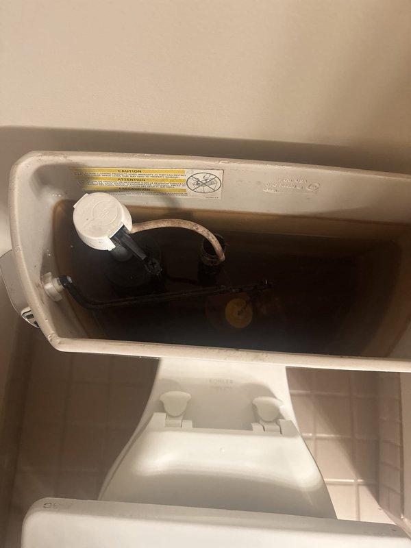 Responded to service call for toilet continuously running and tank constantly filling. Upon inspection, diagnosed failed fill valve assembly as the cause of the issue. Removed tank lid and performed complete rebuild of the fill valve mechanism to restore proper operation and eliminate water waste.