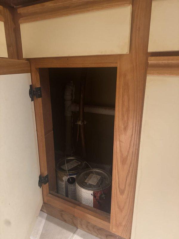 Responded to drainage issue where kitchen sink water was backing up into bar sink. Upon arrival and inspection, tested drainage system and found no active clog or obstruction present. Verified proper water flow through both sink drains with no backup occurring during service visit. System functioning normally at time of inspection.